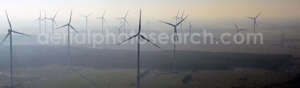 Aerial photograph Werneuchen - Fog landscape with rotors of wind turbines of a wind power plant in Werneuchen in Brandenburg