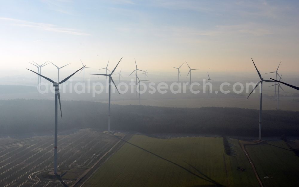 Aerial image Werneuchen - Fog landscape with rotors of wind turbines of a wind power plant in Werneuchen in Brandenburg