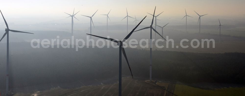 Aerial photograph Werneuchen - Fog landscape with rotors of wind turbines of a wind power plant in Werneuchen in Brandenburg