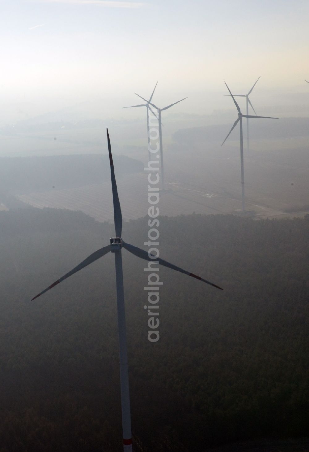 Werneuchen from above - Fog landscape with rotors of wind turbines of a wind power plant in Werneuchen in Brandenburg