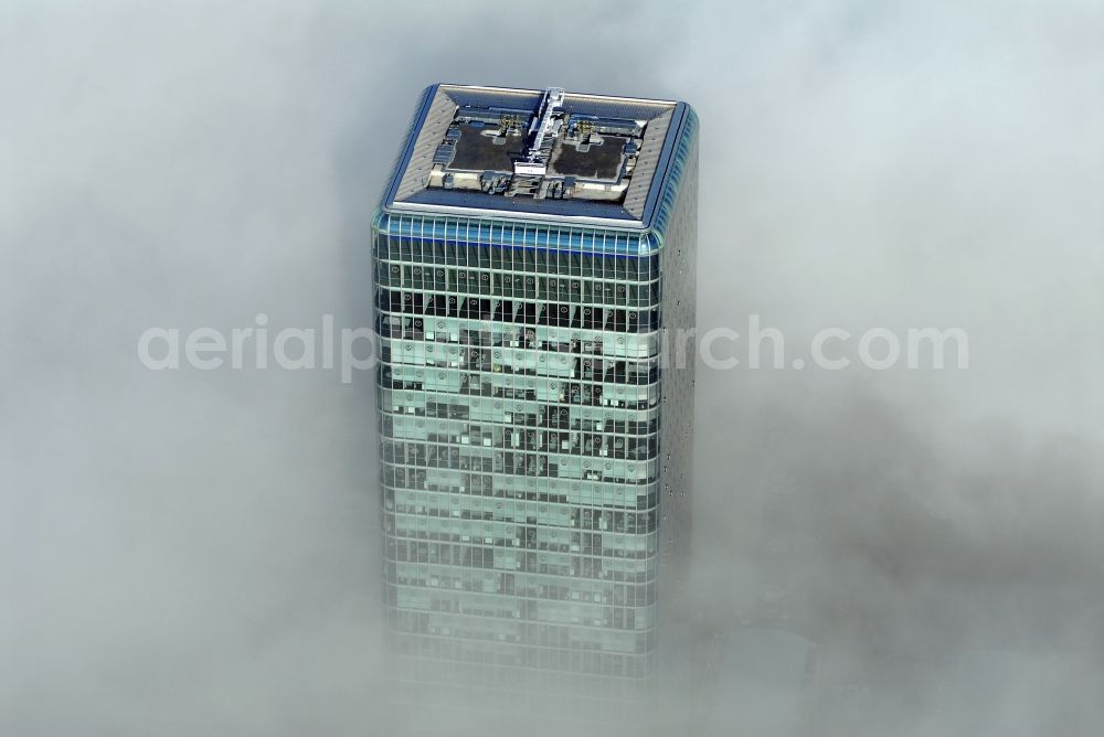 München from the bird's eye view: Outstanding from a layer of fog and high fog, the Uptown high-rise building - headquarters of Telefonica Germany (O2) and Astellas Pharma GmbH on Georg-Brauchle-Ring in the Moosach district of Munich in the state of Bavaria