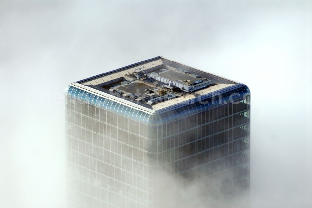 München from the bird's eye view: Outstanding from a layer of fog and high fog, the Uptown high-rise building - headquarters of Telefonica Germany (O2) and Astellas Pharma GmbH on Georg-Brauchle-Ring in the Moosach district of Munich in the state of Bavaria