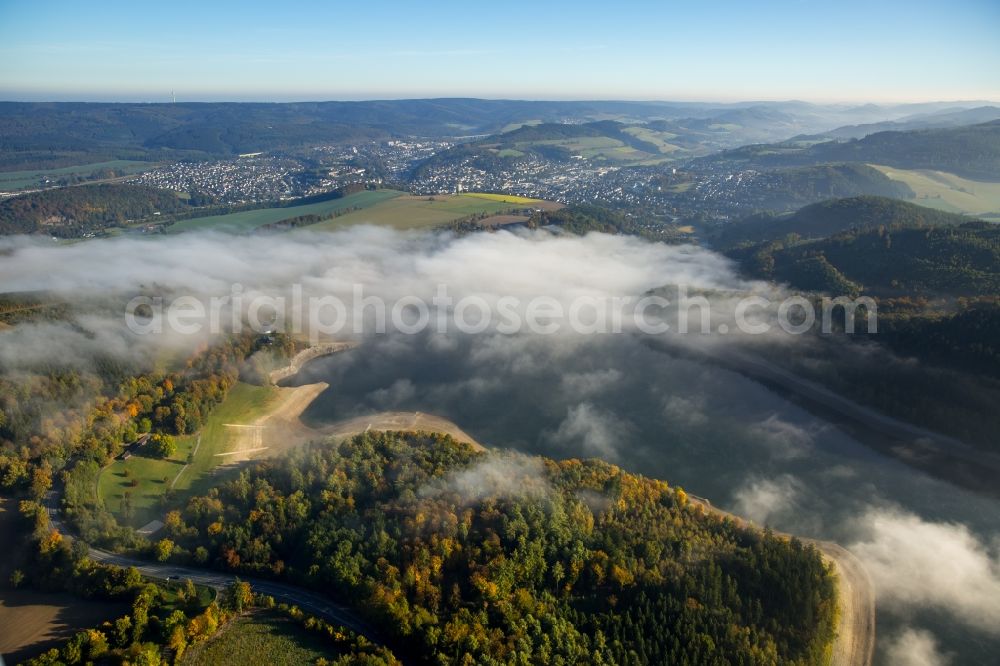 Meschede from above - Fog hanger riparian areas on the lake area of Hennesee in Meschede in the state North Rhine-Westphalia