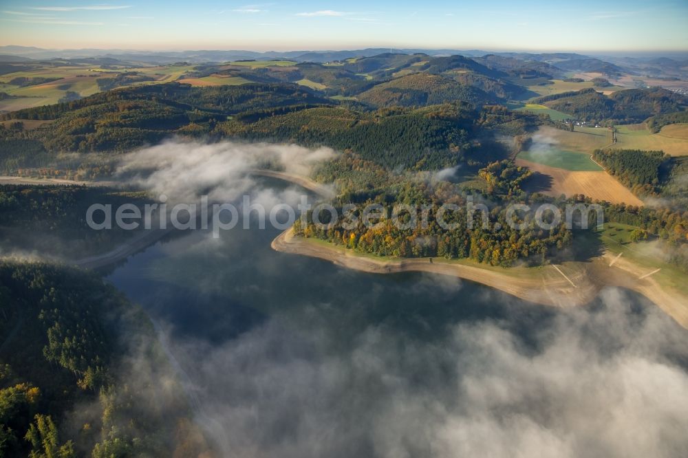 Meschede from above - Fog hanger riparian areas on the lake area of Hennesee in Meschede in the state North Rhine-Westphalia