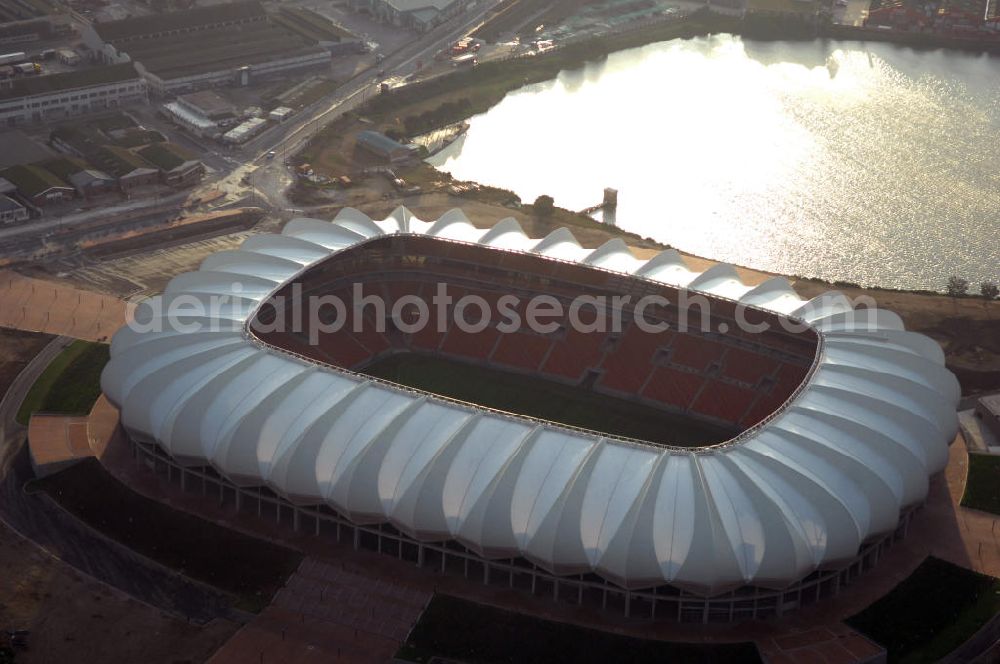 Aerial photograph Port Elizabeth - Blick auf das Nelson - Mandela - Bay - Stadion in Port Elizabeth in der Provinz Eastern Cape in Südafrika vor der Fußball-Weltmeisterschaft 2010. Der architektonische Entwurf stammt vom deutschen Architekturbüro Gerkan, Marg und Partner (gmp), die Tragwerksplanung für das Dach erfolgt durch Ingenieurbüro Schlaich, Bergermann und Partner. Das Stadion steht am North End Lake. View of the Nelson-Mandela-Bay-Stadium in Port Elizabeth in South Af?????????????????????????????????