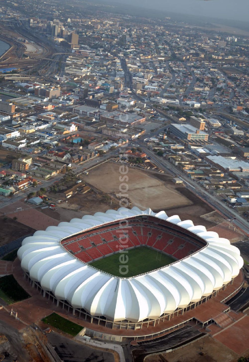 Aerial image Port Elizabeth - Blick auf das Nelson - Mandela - Bay - Stadion in Port Elizabeth in der Provinz Eastern Cape in Südafrika vor der Fußball-Weltmeisterschaft 2010. Der architektonische Entwurf stammt vom deutschen Architekturbüro Gerkan, Marg und Partner (gmp), die Tragwerksplanung für das Dach erfolgt durch Ingenieurbüro Schlaich, Bergermann und Partner. Das Stadion steht am North End Lake. View of the Nelson-Mandela-Bay-Stadium in Port Elizabeth in South Af?????????????????????????????????