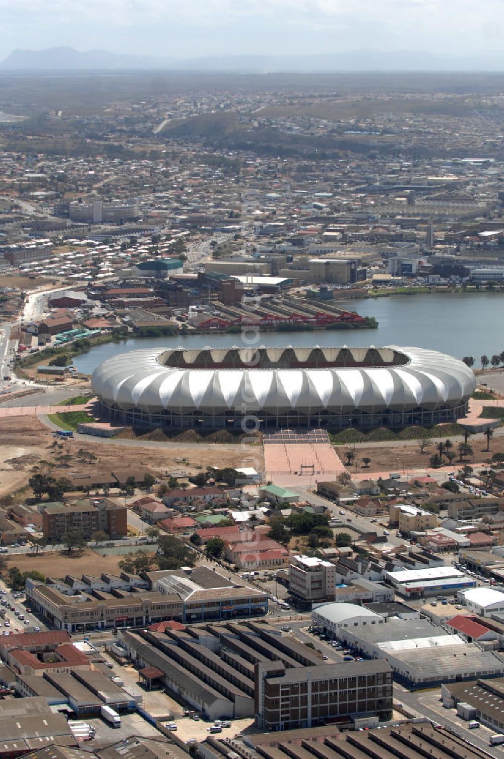 Aerial photograph Port Elizabeth - Blick auf das Nelson - Mandela - Bay - Stadion in Port Elizabeth in der Provinz Eastern Cape in Südafrika vor der Fußball-Weltmeisterschaft 2010. Der architektonische Entwurf stammt vom deutschen Architekturbüro Gerkan, Marg und Partner (gmp), die Tragwerksplanung für das Dach erfolgt durch Ingenieurbüro Schlaich, Bergermann und Partner. Das Stadion steht am North End Lake. View of the Nelson-Mandela-Bay-Stadium in Port Elizabeth in South Af?????????????????????????????????