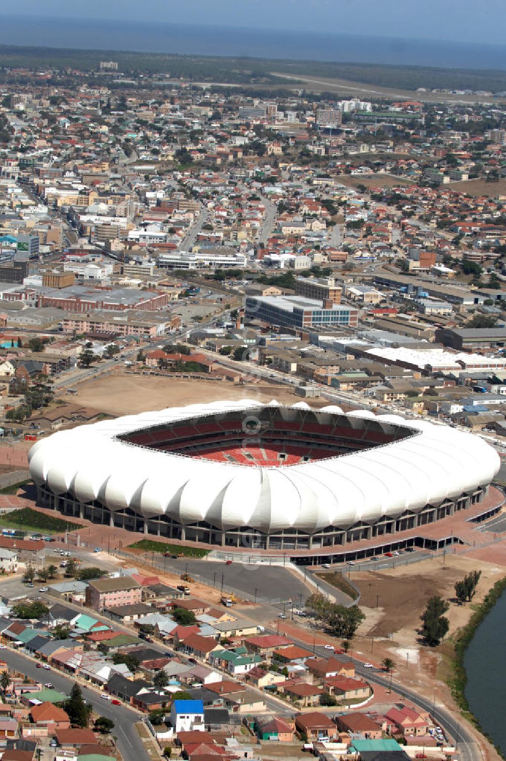 Aerial photograph Port Elizabeth - Blick auf das Nelson - Mandela - Bay - Stadion in Port Elizabeth in der Provinz Eastern Cape in Südafrika vor der Fußball-Weltmeisterschaft 2010. Der architektonische Entwurf stammt vom deutschen Architekturbüro Gerkan, Marg und Partner (gmp), die Tragwerksplanung für das Dach erfolgt durch Ingenieurbüro Schlaich, Bergermann und Partner. Das Stadion steht am North End Lake. View of the Nelson-Mandela-Bay-Stadium in Port Elizabeth in South Af?????????????????????????????????