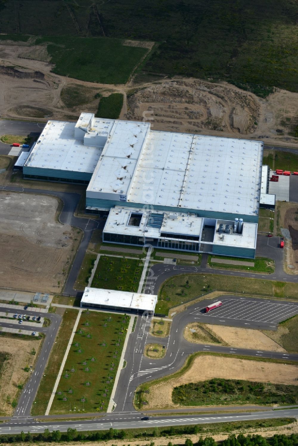 Schwerin from the bird's eye view: Nestle - construction site for a manufacturing plant in the Industrial Park Schwerin in Mecklenburg - Western Pomerania