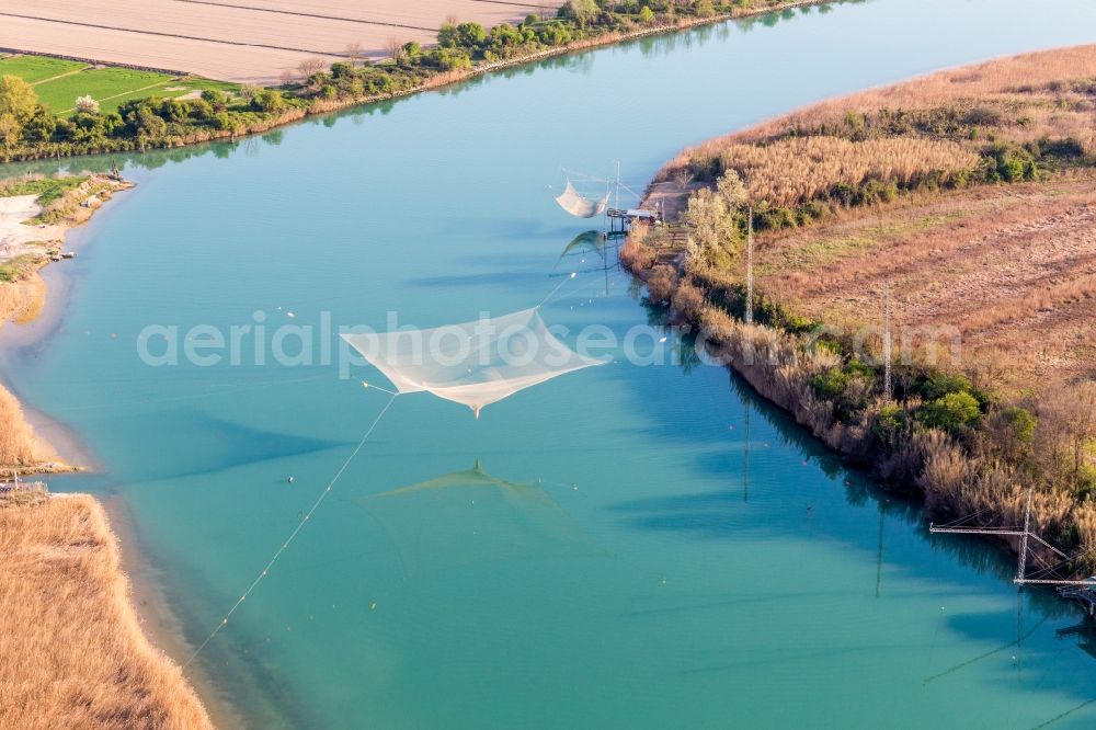 Aerial image Revedoli - Fisher nets at the course of the river of Piave in Revedoli in Venetien, Italy