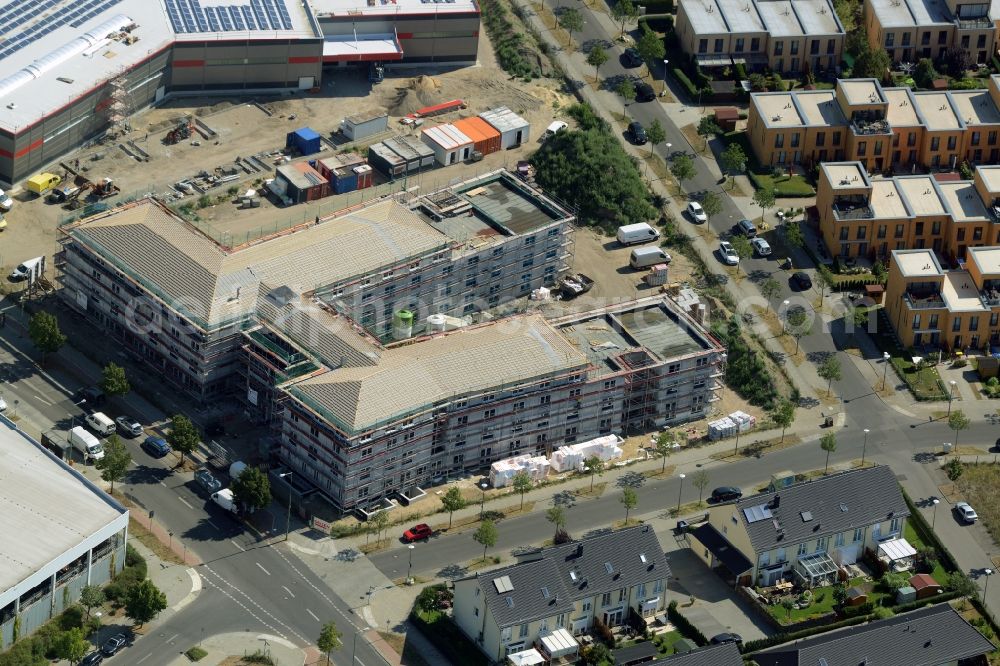 Berlin from above - Building the retirement home on Apollofalteralle in the Biesdorf park of the district of Marzahn-Hellersdorf in Berlin in Germany. The construction site is located in the development area of Biesdorf-Sued. The project is run by Deisen Bau and was designed by Milkoweit Architekten Cohrs Plaasch GbR