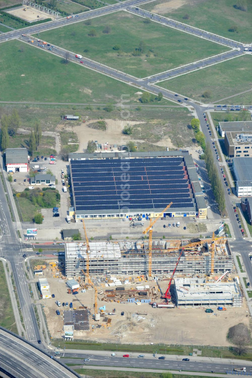 Aerial image Berlin-Adlershof - Neubau des Audi Terminal in Berlin - Adlershof. Die Audi Retail GmbH investiert über 30 Mio Euro, um den Standort zu einem der größten Audi- Zentren in Deutschland auszubauen. Auf über 20.000 Quadratmetern wird ab 2012 der Handelsbetrieb beginnen. Die Baufirma ZÜBLIN errichtet das künftige Flaggschiff der 18 deutschen Audi Terminals. Construction of the Audi Terminal in Berlin - Adlershof.