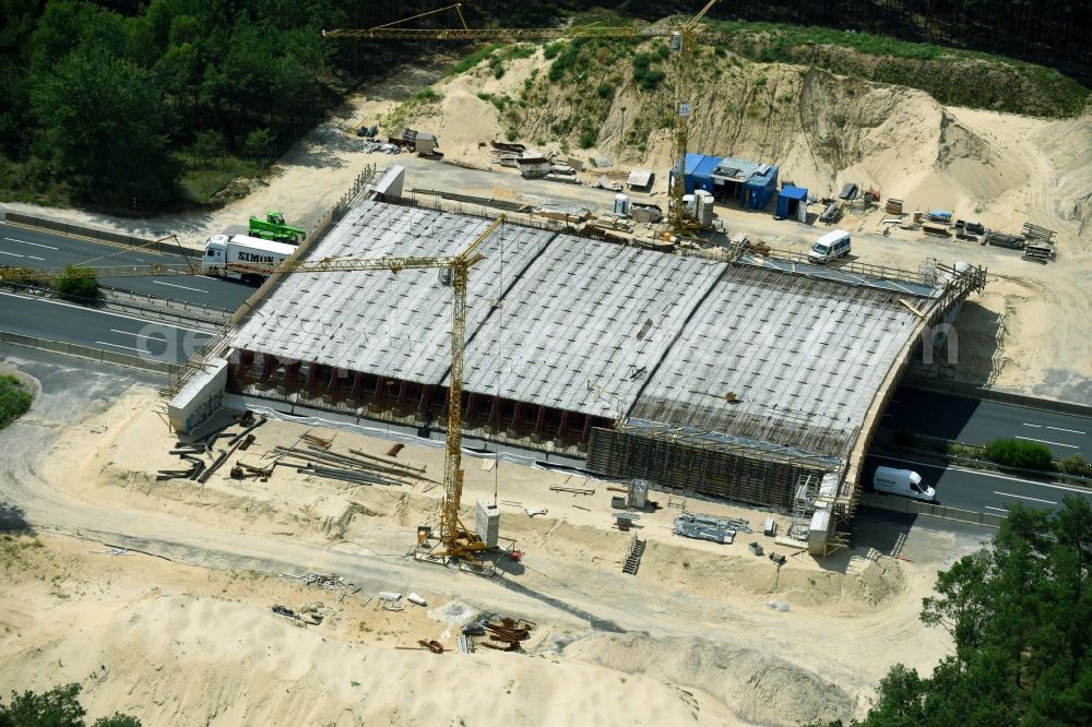 Aerial photograph Beelitz - Construction site of highway bridge structure applied as a wildlife crossing bridge Wild - Wild swap the BAB A 9 through the ARIKON BAU AG in Beelitz in the state Brandenburg, Germany