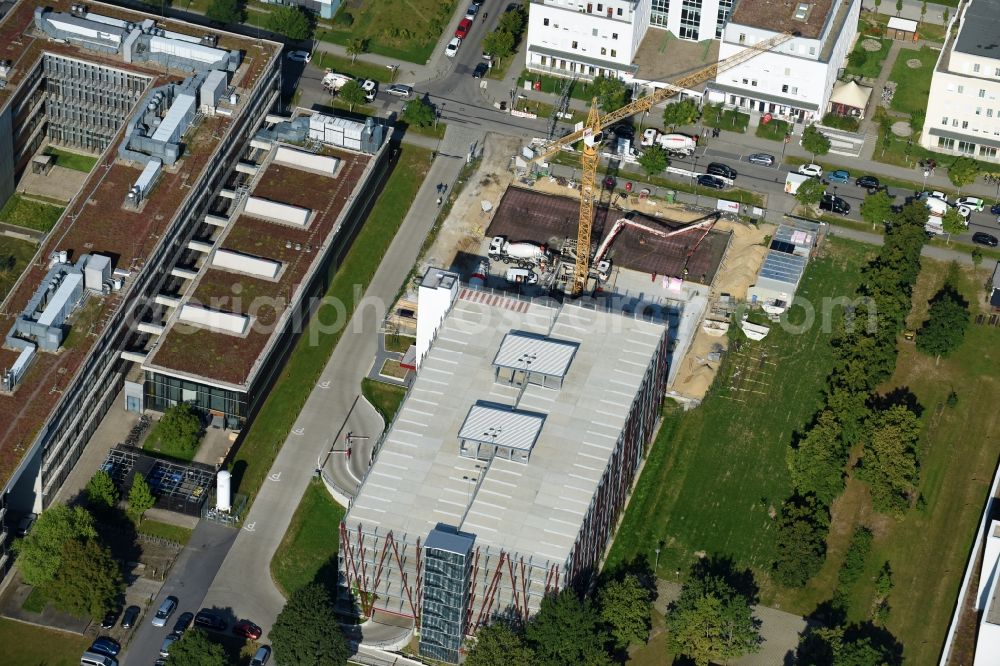 Berlin from the bird's eye view: New building construction site in the industrial park on EUROPA-CENTER Parkhaus Berlin on Albert-Einstein-Strasse in the district Adlershof in Berlin, Germany