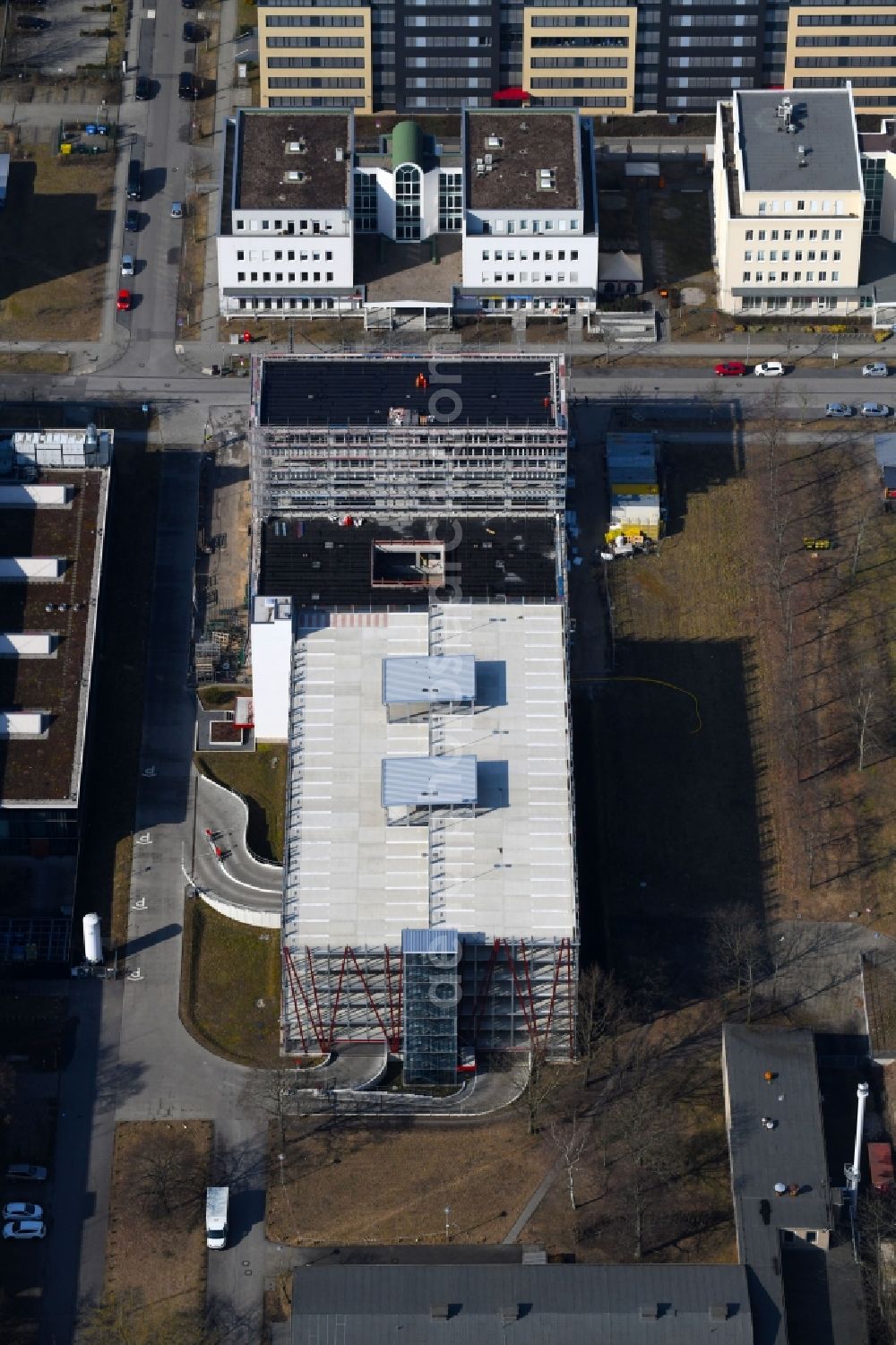 Berlin from the bird's eye view: New building construction site in the industrial park on EUROPA-CENTER Parkhaus Berlin on Albert-Einstein-Strasse in the district Adlershof in Berlin, Germany