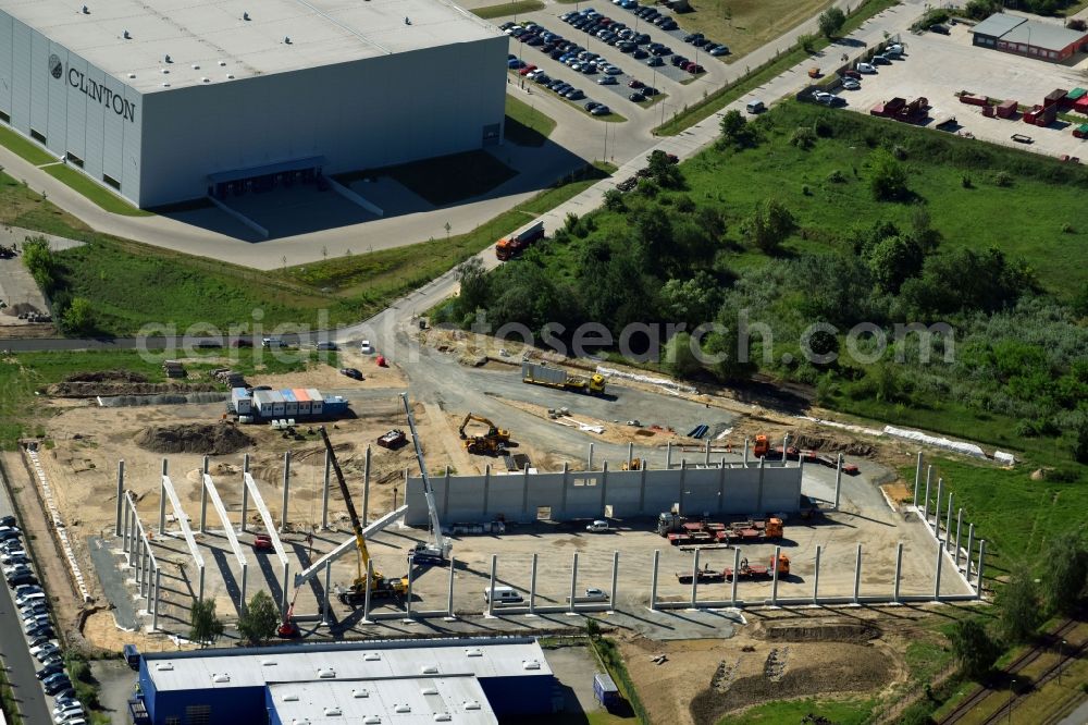 Hoppegarten from the bird's eye view: New building construction site in the industrial park Industriestrasse - Alter Feldweg of Firma coolback GmbH in the district Dahlwitz-Hoppegarten in Hoppegarten in the state Brandenburg, Germany