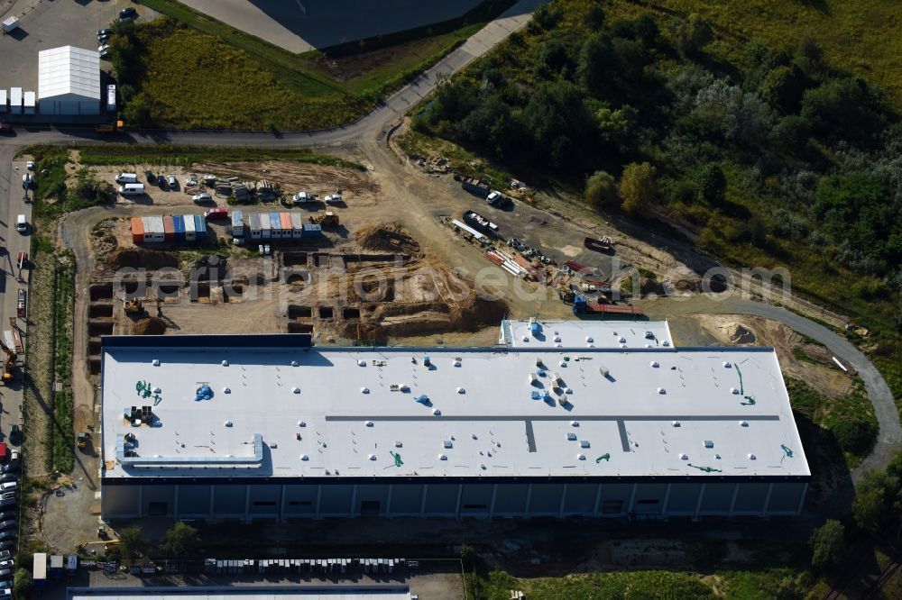 Hoppegarten from the bird's eye view: New building construction site in the industrial park Industriestrasse - Alter Feldweg of Firma coolback GmbH in the district Dahlwitz-Hoppegarten in Hoppegarten in the state Brandenburg, Germany