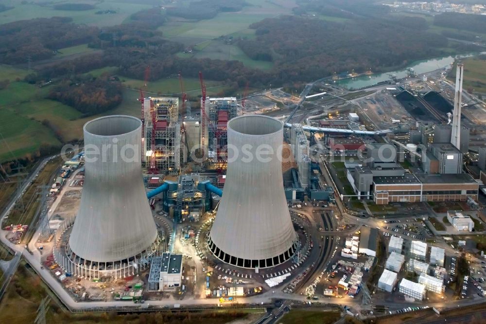 Aerial image Hamm - Construction site of the Westfalen power plant at dusk. The coal-fired power plant of RWE in the Siegenbeckstrasse in Schmehausen district in Hamm in North Rhine-Westphalia is extended by the coal blocks D and E with two cooling towers