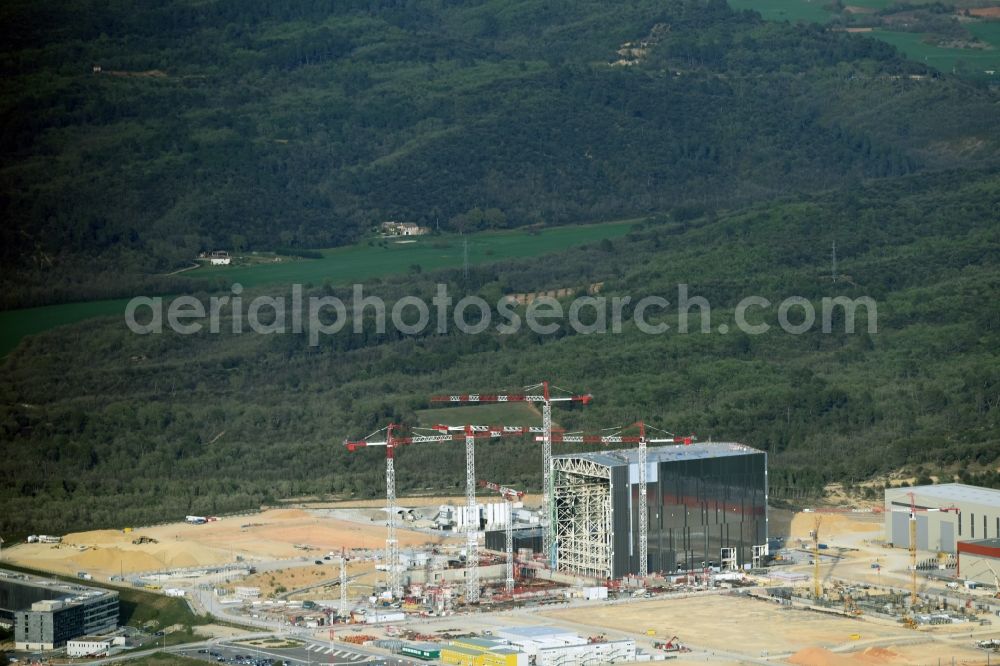 Saint-Paul-lez-Durance from above - Construction site of Building remains of the reactor units and facilities of the NPP nuclear power plant institut CEA Cadarache in Saint-Paul-lez-Durance in Provence-Alpes-Cote d'Azur, France