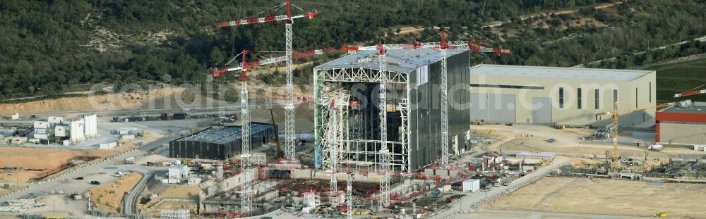 Saint-Paul-lez-Durance from above - Construction site of Building remains of the reactor units and facilities of the NPP nuclear power plant institut CEA Cadarache in Saint-Paul-lez-Durance in Provence-Alpes-Cote d'Azur, France