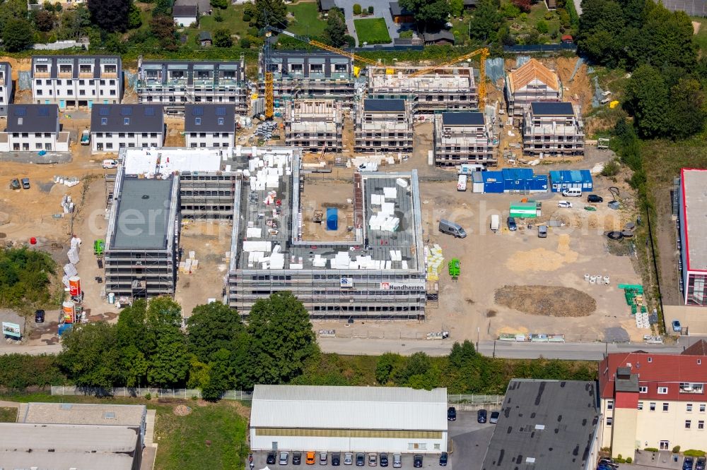 Aerial image Schwelm - New construction site of the administrative buildings of the state authority of the district administration Schwelm at Rheinische Str. in Schwelm in the state North Rhine-Westphalia, Germany. The building was planned by the company Hundhausen. You can also see the construction of a terraced housing development by project developer Bonava on Gustav-Heinemann-Strasse