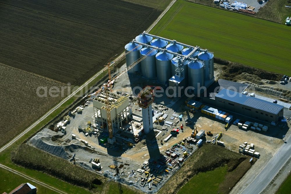 Mindelheim from the bird's eye view: New construction - construction site on the buildings and production halls of the factory premises der A.G.H. - Agrarhandelsges. Mbh on Stillachstrasse in Mindelheim in the state Bavaria, Germany