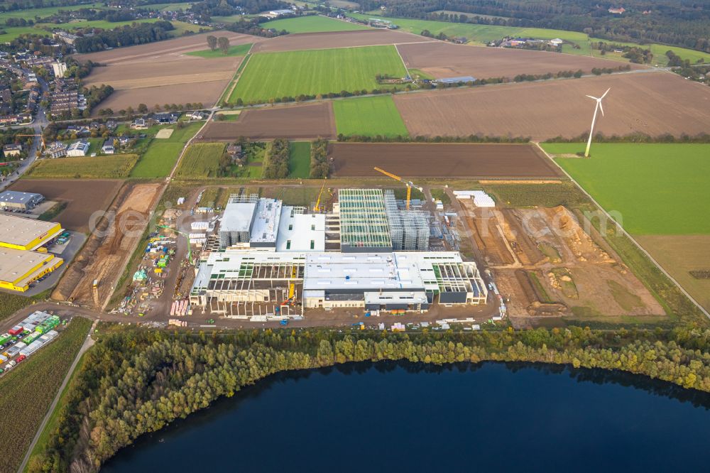 Aerial image Weeze - New construction site for the construction of buildings and production halls on the factory premises for the production of heavy corrugated cardboard on the street Am Sandthof in the district of Goch in Weeze in the federal state of North Rhine-Westphalia, Germany