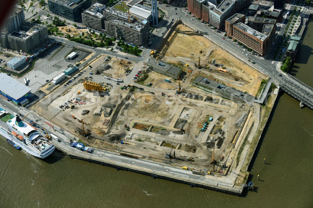 Hamburg from the bird's eye view: Construction site for the new building complex of the shopping center at Ueberseequartier at Chicagokai - Osakaallee in the area of the former Grasbrooks in the Hafencity district in Hamburg, Germany