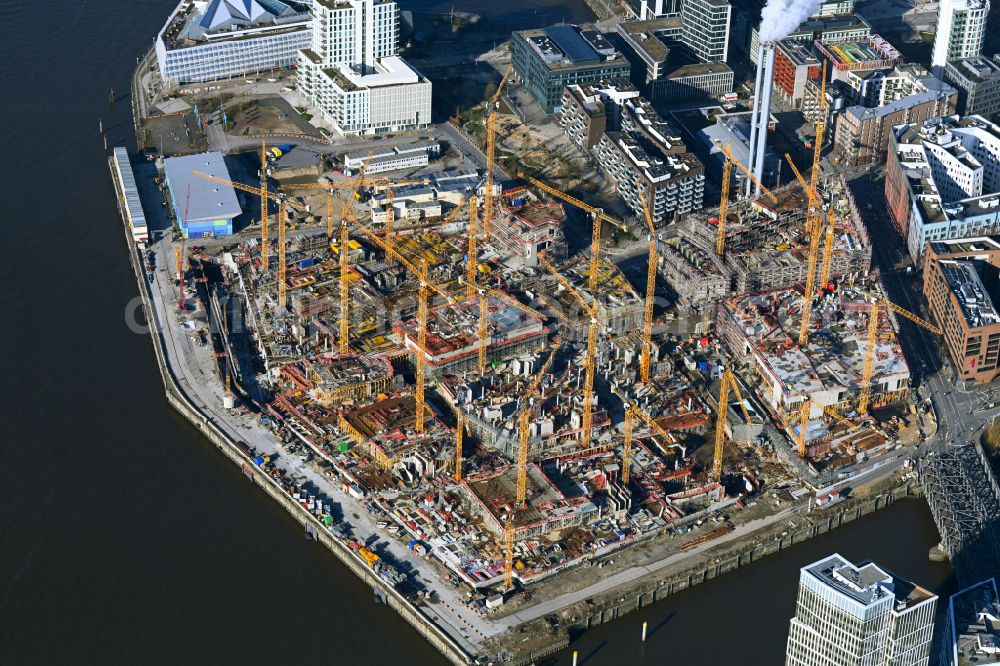 Hamburg from the bird's eye view: Construction site for the new building complex of the shopping center at Ueberseequartier at Chicagokai - Osakaallee in the area of the former Grasbrooks in the Hafencity district in Hamburg, Germany