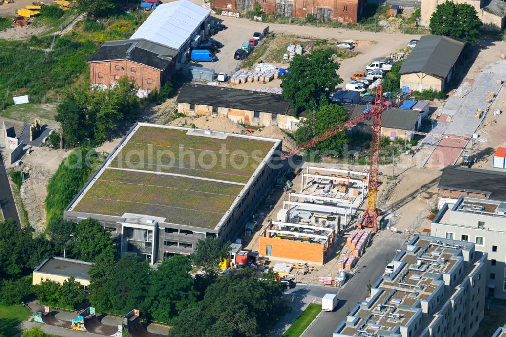 Berlin from the bird's eye view: Construction site of the depot of the with Werkstatt of GESOBAU on street Elfriede-Bruening-Strasse - Alt-Hellersdorf - Sarah-Kirsch-Strasse in the district Hellersdorf in Berlin, Germany