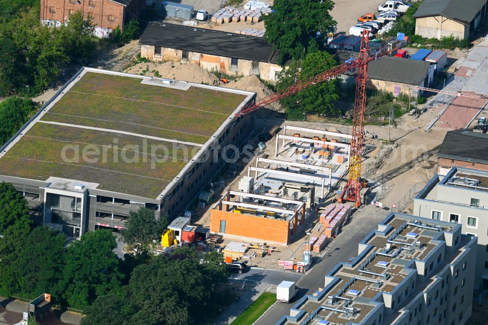 Aerial image Berlin - Construction site of the depot of the with Werkstatt of GESOBAU on street Elfriede-Bruening-Strasse - Alt-Hellersdorf - Sarah-Kirsch-Strasse in the district Hellersdorf in Berlin, Germany