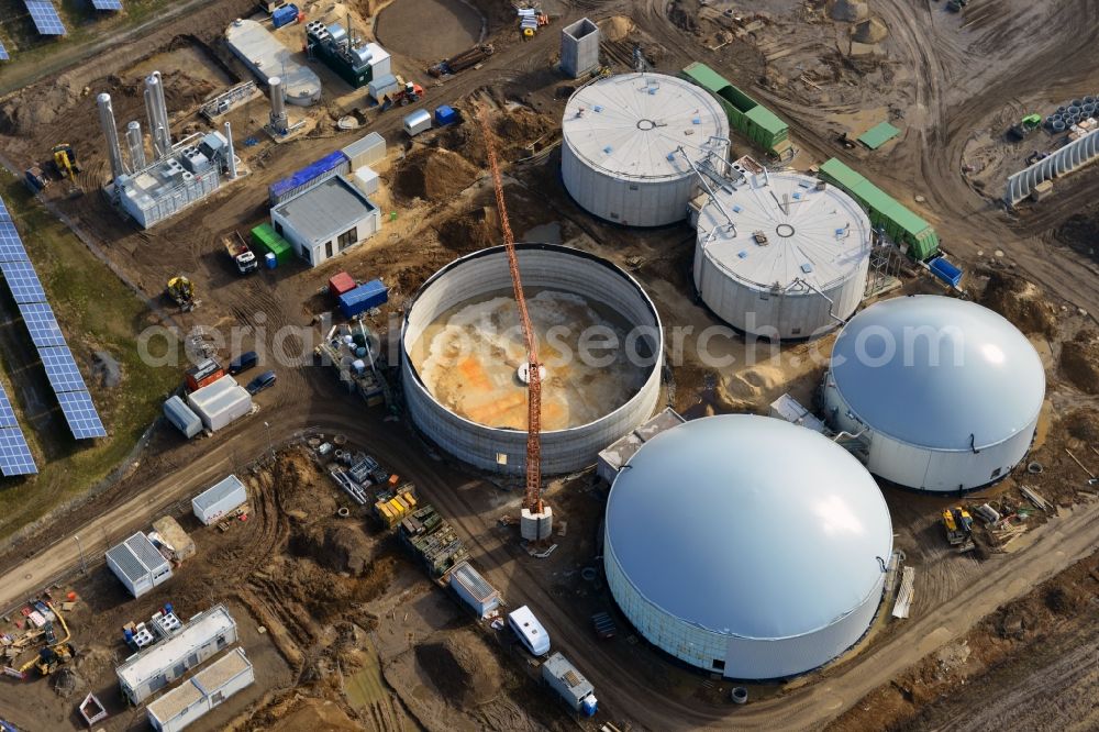 Aerial image Oberkrämer - Construction of a biogas - plant on solar park in Oberkrämer in Brandenburg. The solar energy and photovoltaic location for renewable energy provides 36% of EEG power