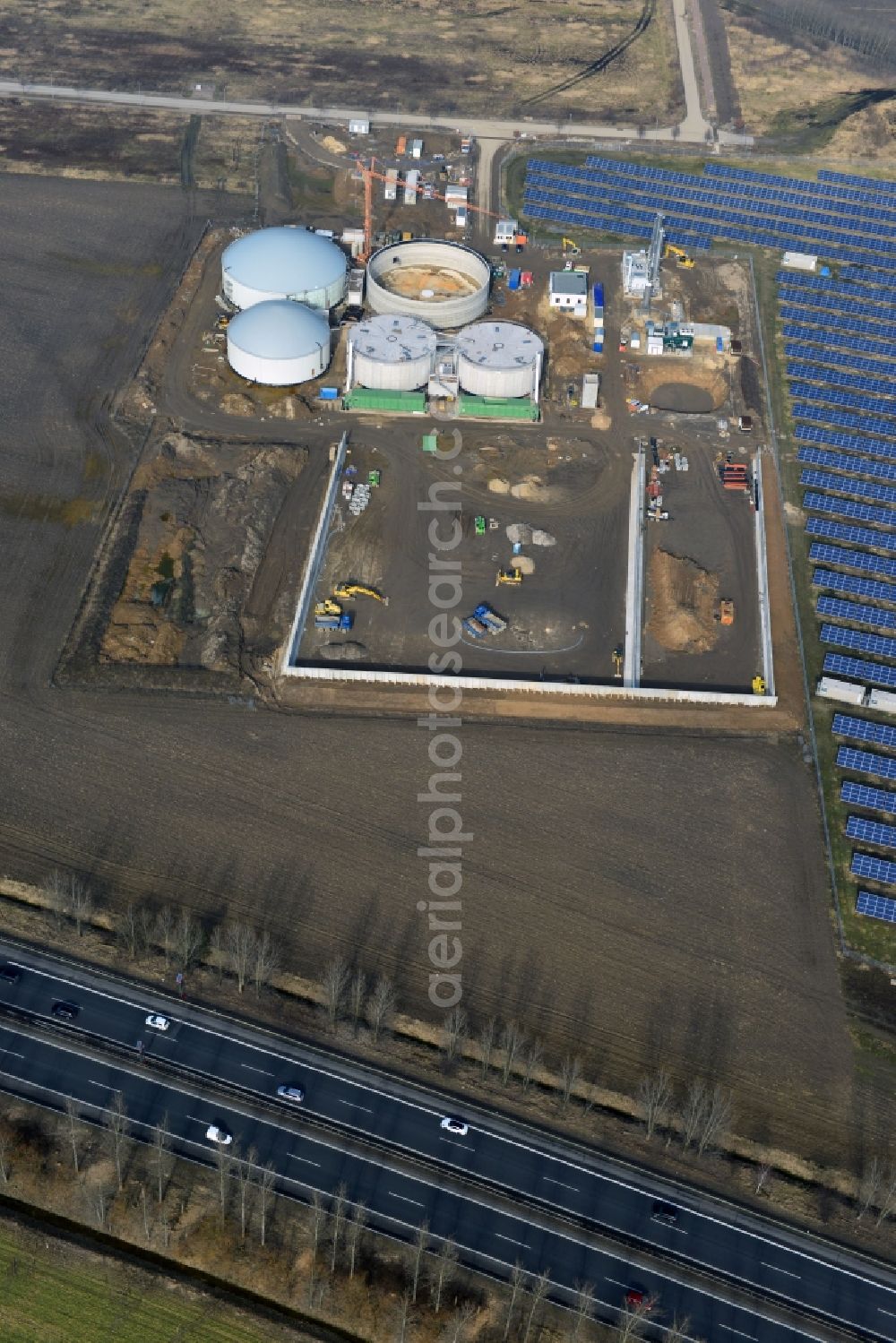 Oberkrämer from the bird's eye view: Construction of a biogas - plant on solar park in Oberkrämer in Brandenburg. The solar energy and photovoltaic location for renewable energy provides 36% of EEG power