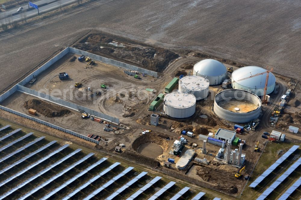 Aerial image Oberkrämer - Construction of a biogas - plant on solar park in Oberkrämer in Brandenburg. The solar energy and photovoltaic location for renewable energy provides 36% of EEG power