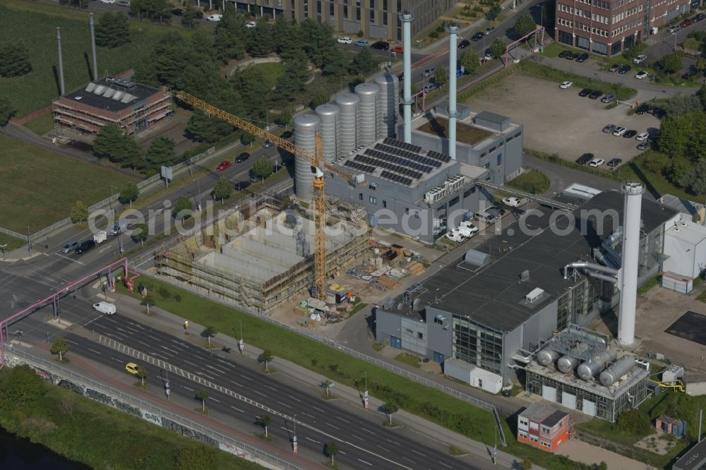 Berlin from above - Construction site of power plants and exhaust towers of thermal power station of the Blockkraftkraftwerk - regional heating plant of BTB Blockheizkraftwerks-Traeger- and Betreibergesellschaft mbH on Wegedornstrasse - Ernst-Ruska-Ufer in the district Adlershof in Berlin, Germany