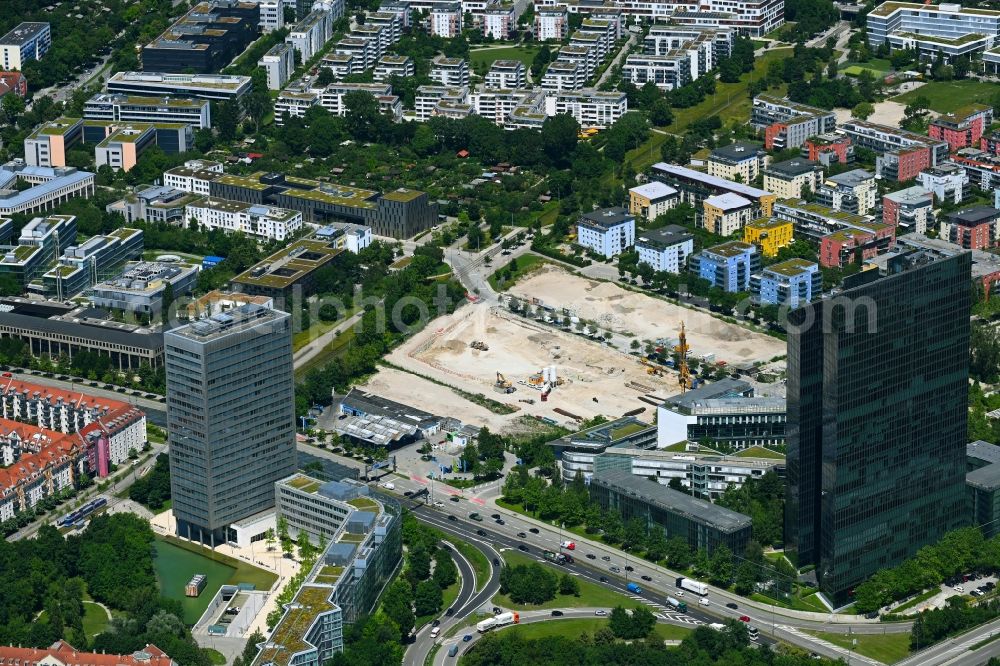 München from the bird's eye view: Construction site to build a new office and commercial building on Anni-Albers-Strasse - Lyonel-Feininger-Strasse in the district Schwabing in Munich in the state Bavaria, Germany