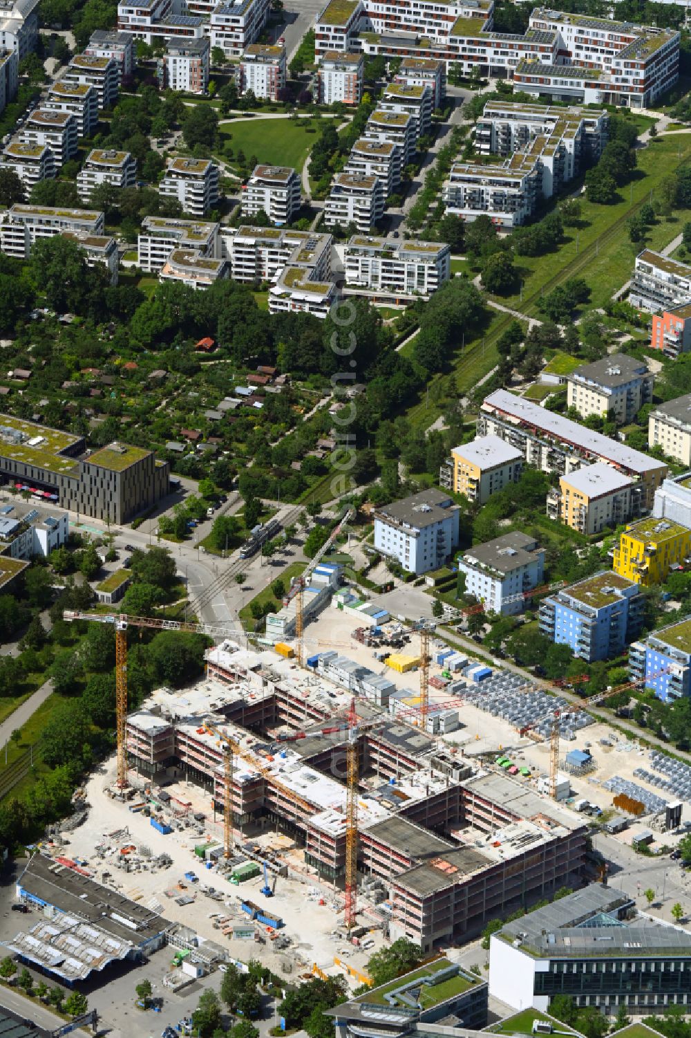 München from the bird's eye view: Construction site to build a new office and commercial building on Anni-Albers-Strasse - Lyonel-Feininger-Strasse in the district Schwabing in Munich in the state Bavaria, Germany