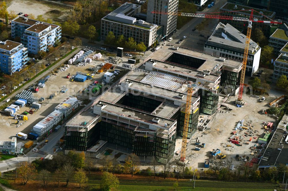 München from the bird's eye view: Construction site to build a new office and commercial building on Anni-Albers-Strasse - Lyonel-Feininger-Strasse in the district Schwabing in Munich in the state Bavaria, Germany