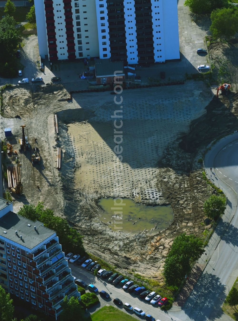 Rostock from the bird's eye view: Construction site to build a new office and commercial building on Bahnhofsvorplatz in the district Suedstadt in Rostock in the state Mecklenburg - Western Pomerania, Germany