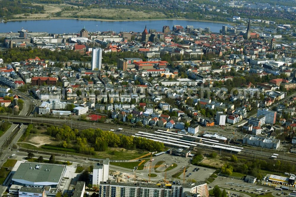 Rostock from the bird's eye view: Construction site to build a new office and commercial building on Bahnhofsvorplatz in the district Suedstadt in Rostock in the state Mecklenburg - Western Pomerania, Germany