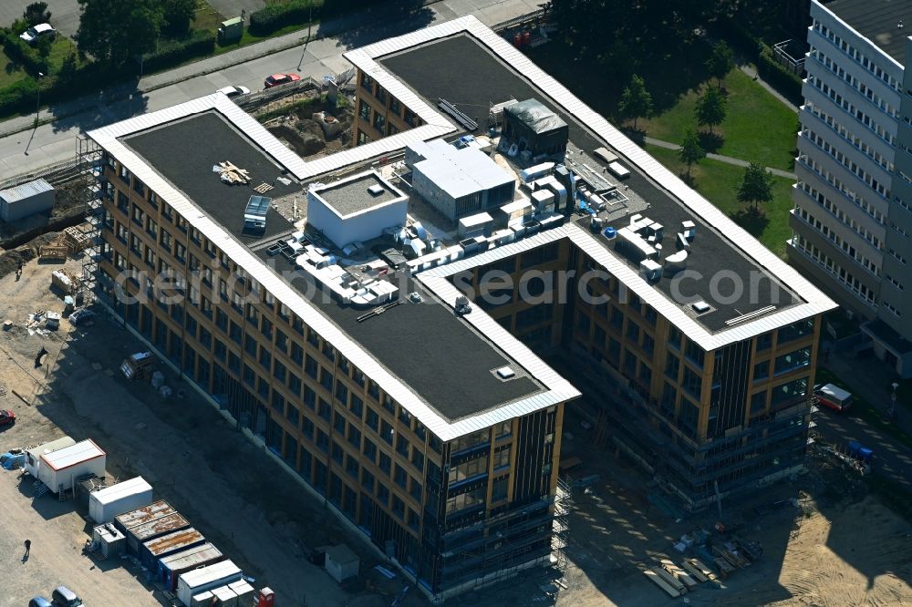 Berlin from the bird's eye view: Construction site to build a new office and commercial building on Beilsteiner Strasse in the district Marzahn in Berlin, Germany