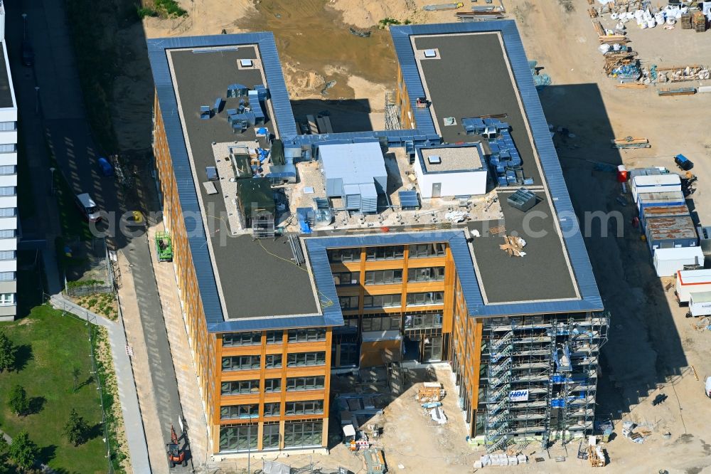 Berlin from above - Construction site to build a new office and commercial building on Beilsteiner Strasse in the district Marzahn in Berlin, Germany