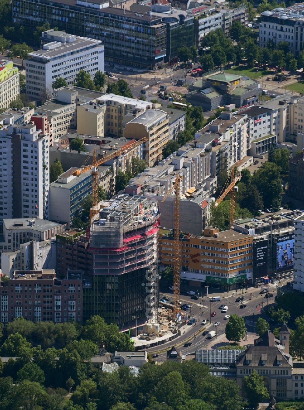 Berlin from the bird's eye view: Construction site to build a new office and commercial building on Budapester Strasse corner Kurfuerstenstrasse in the district Tiergarten in Berlin, Germany