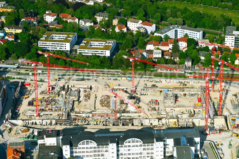 Jena from the bird's eye view: Construction site for the new construction of an office and commercial building for the new company headquarters for the Medical Technology and Research Microscopy Solutions division of Carl Zeiss Meditec AG and Carl Zeiss AG on street Otto-Schott-Strasse in Jena in the state of Thuringia, Germany