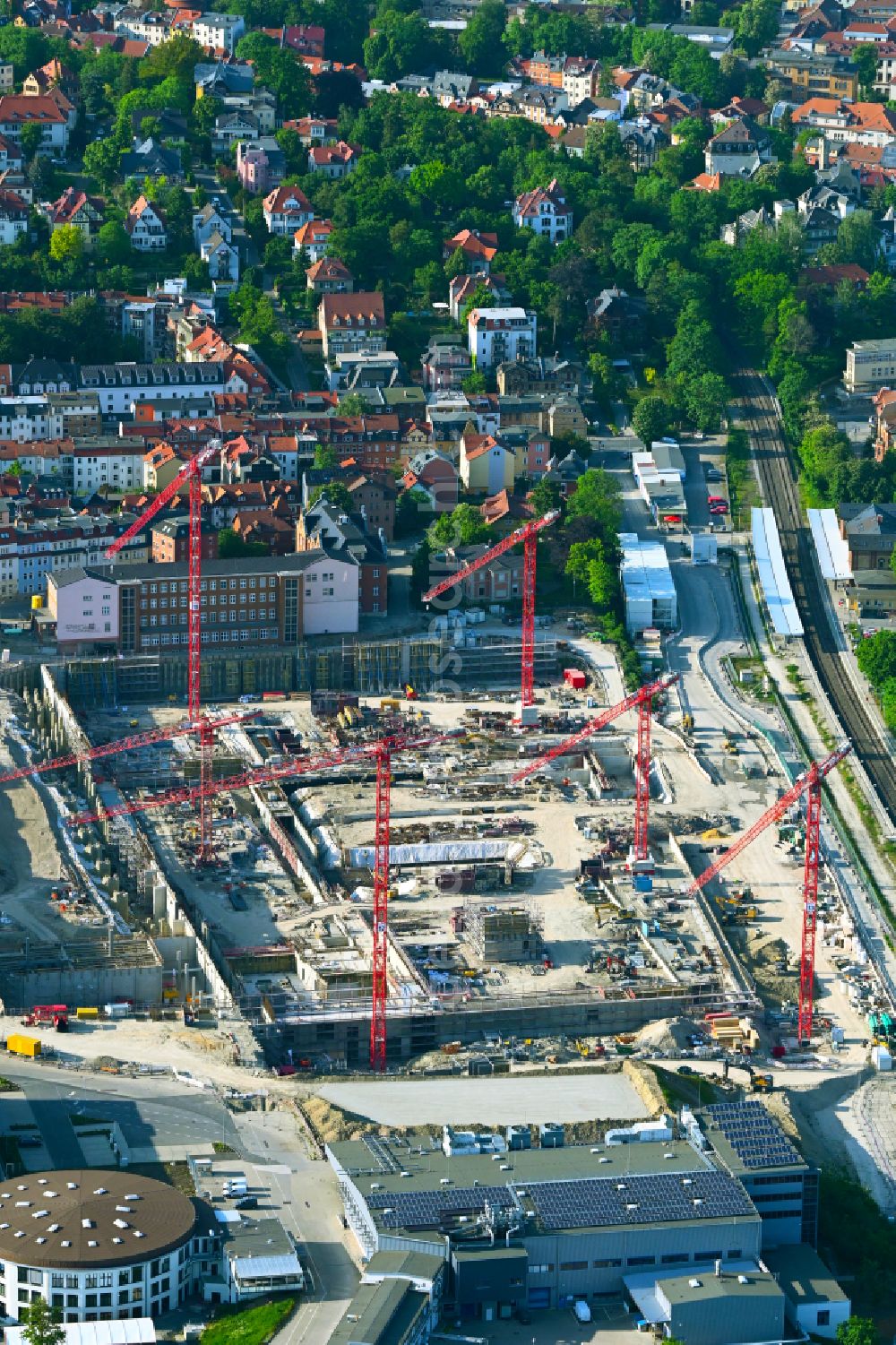 Aerial photograph Jena - Construction site for the new construction of an office and commercial building for the new company headquarters for the Medical Technology and Research Microscopy Solutions division of Carl Zeiss Meditec AG and Carl Zeiss AG on street Otto-Schott-Strasse in Jena in the state of Thuringia, Germany