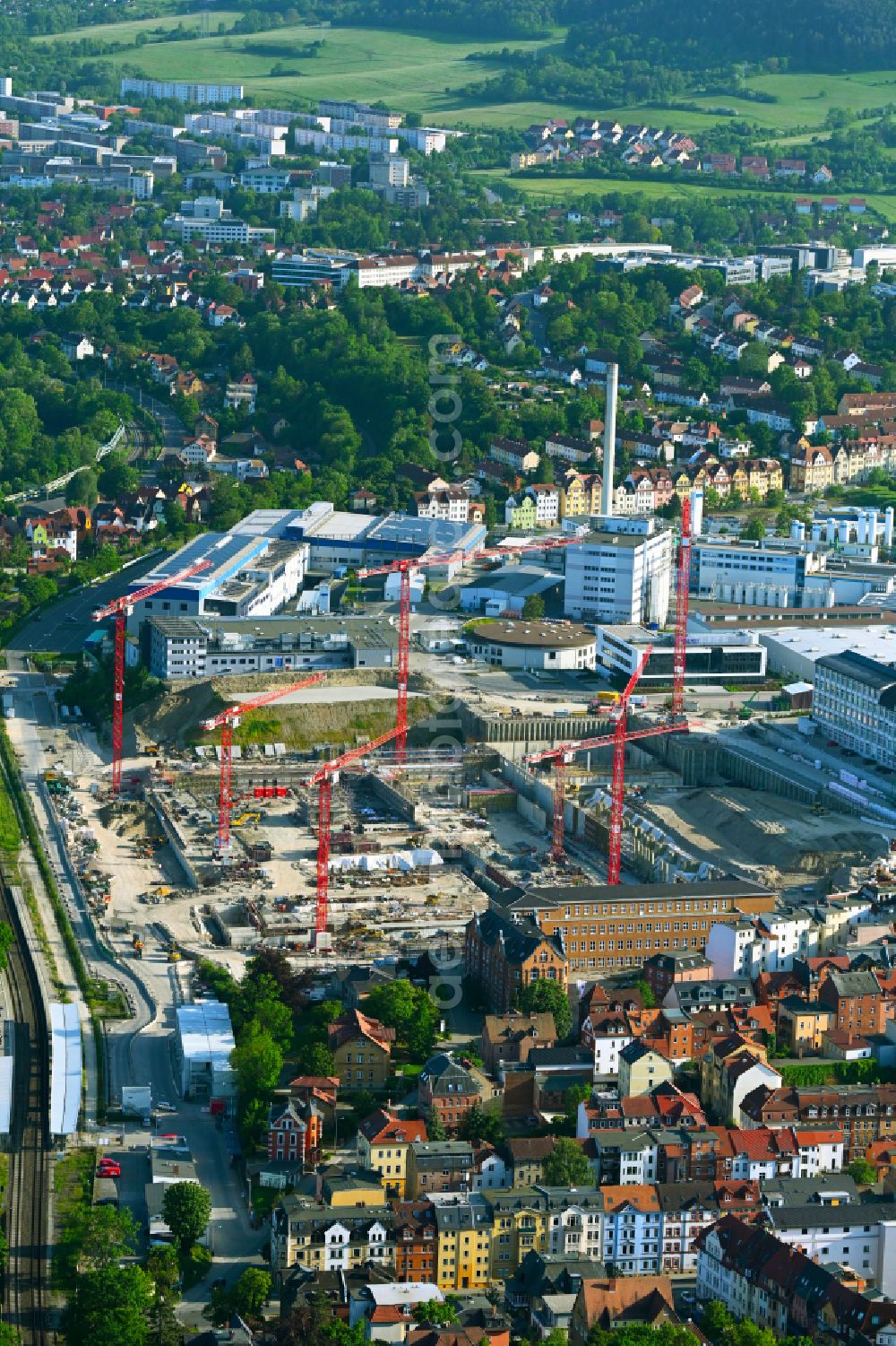 Aerial photograph Jena - Construction site for the new construction of an office and commercial building for the new company headquarters for the Medical Technology and Research Microscopy Solutions division of Carl Zeiss Meditec AG and Carl Zeiss AG on street Otto-Schott-Strasse in Jena in the state of Thuringia, Germany