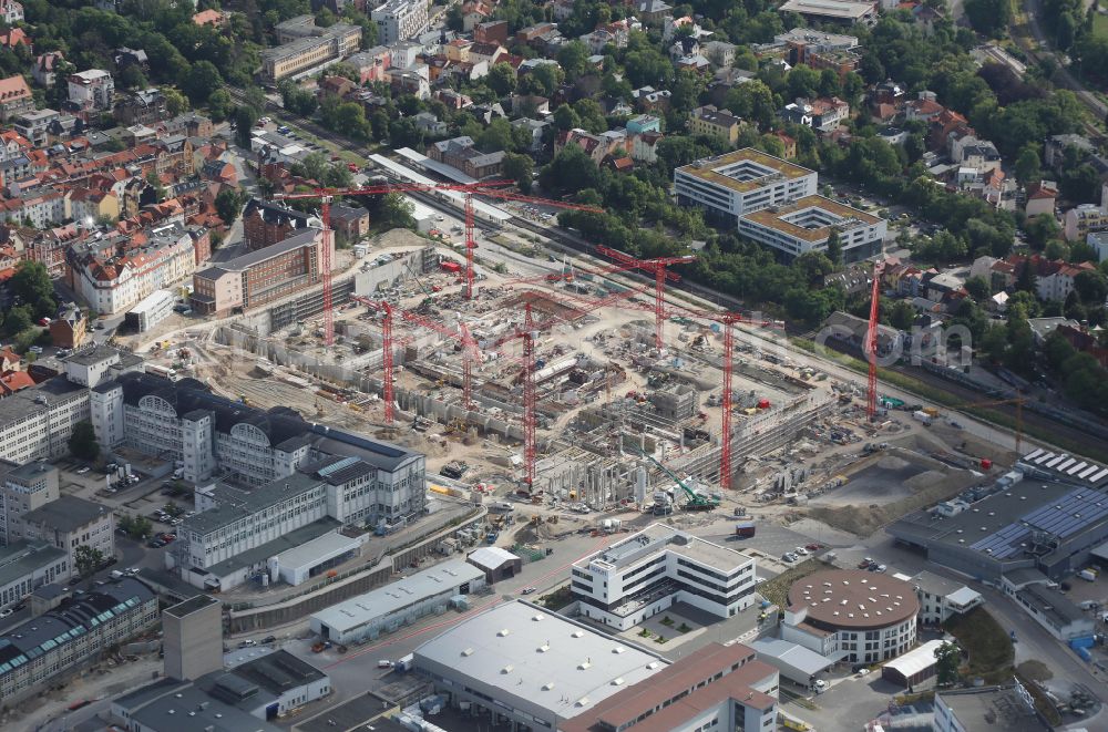 Jena from above - Construction site for the new construction of an office and commercial building for the new company headquarters for the Medical Technology and Research Microscopy Solutions division of Carl Zeiss Meditec AG and Carl Zeiss AG on street Otto-Schott-Strasse in Jena in the state of Thuringia, Germany