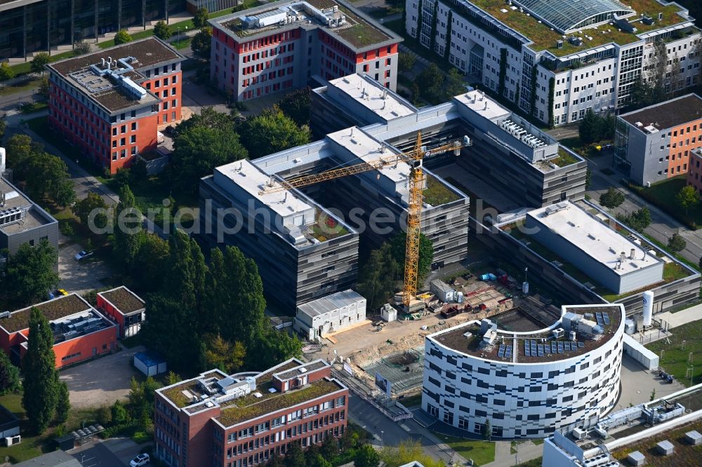 Aerial photograph Berlin - Construction site to build a new office and commercial building DanGreen an of Magnusstrasse - Max-Planck-Strasse in the district Adlershof in Berlin, Germany