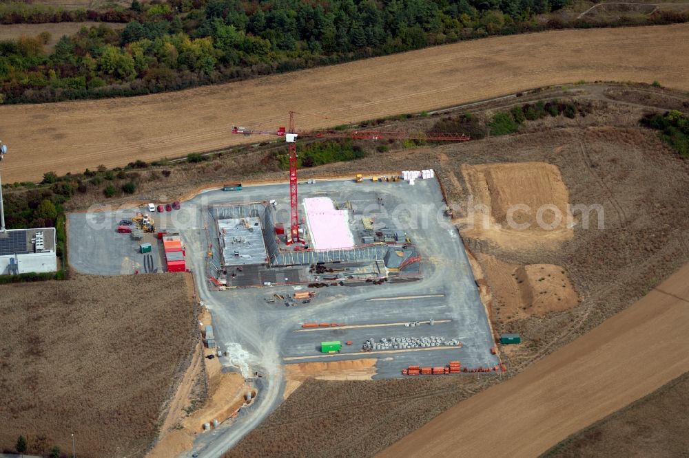 Würzburg from the bird's eye view: Construction site to build a new office and commercial building on Delpstrasse in the district Heuchelhof in Wuerzburg in the state Bavaria, Germany