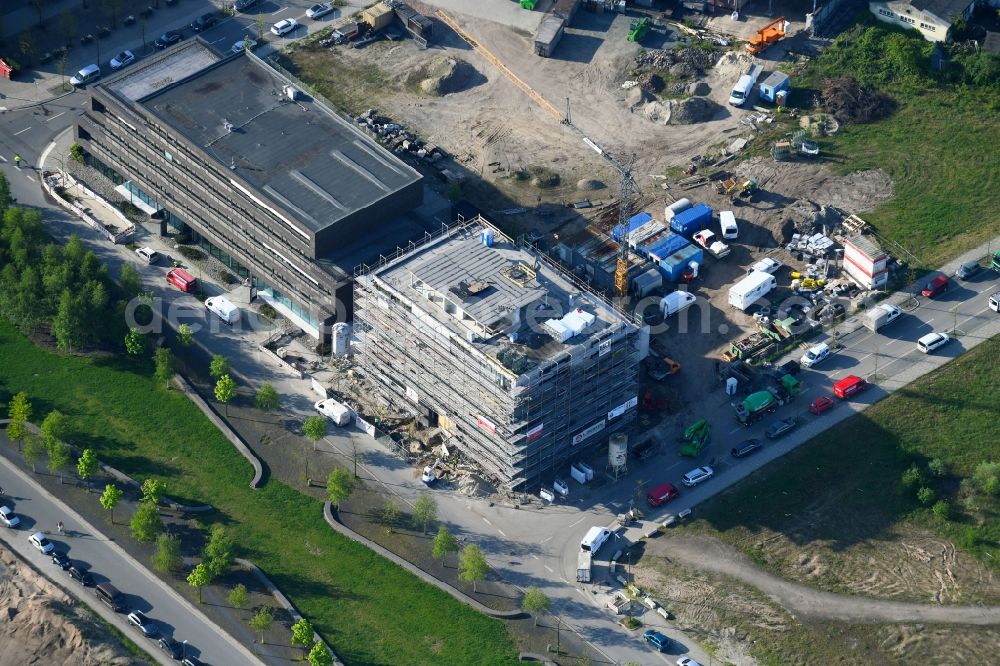 Aerial photograph Bremen - Construction site to build a new office and commercial building in the development area of Ueberseestadt in Bremen, Germany